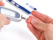Pic of blood being taken from the finger of a diabetic that has periodontal disease.