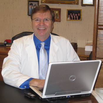 Picture of Dr. Rabalais in his dental office.
